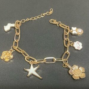 Custom made white & gold whimsical charm bracelet
